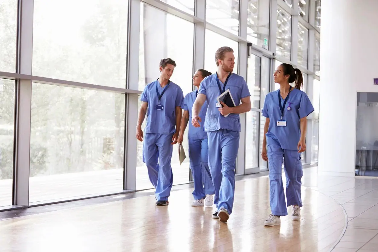 A group of doctors walking down the hallway